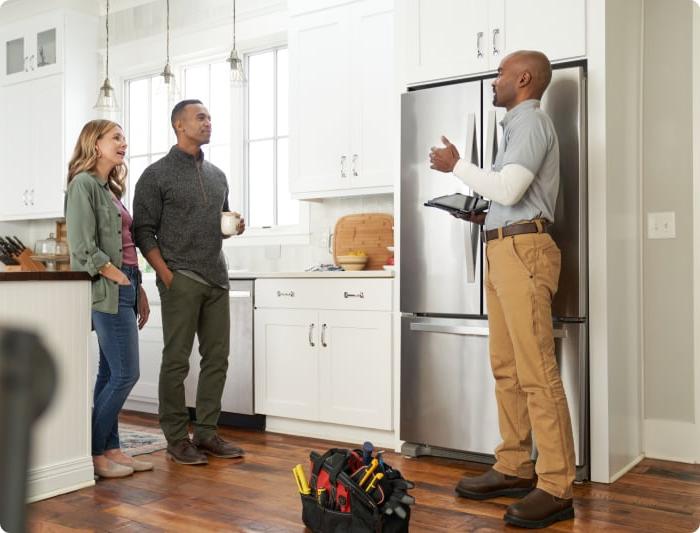 couple speaking to repair pro